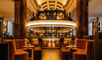 Bar and couches in a nicely lit room