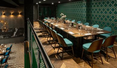 A large table set out for dinner service.