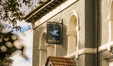 The exterior of Hightown Inn with a sign above the door saying 'Hightown Inn'.
