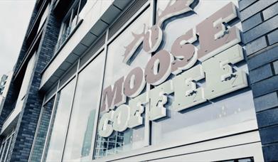 Moose Coffee sign on the outside of the building