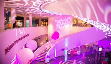 Museum of Liverpool interior stairs and pink lighting.