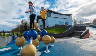 Children playing outside Catalyst Museum.